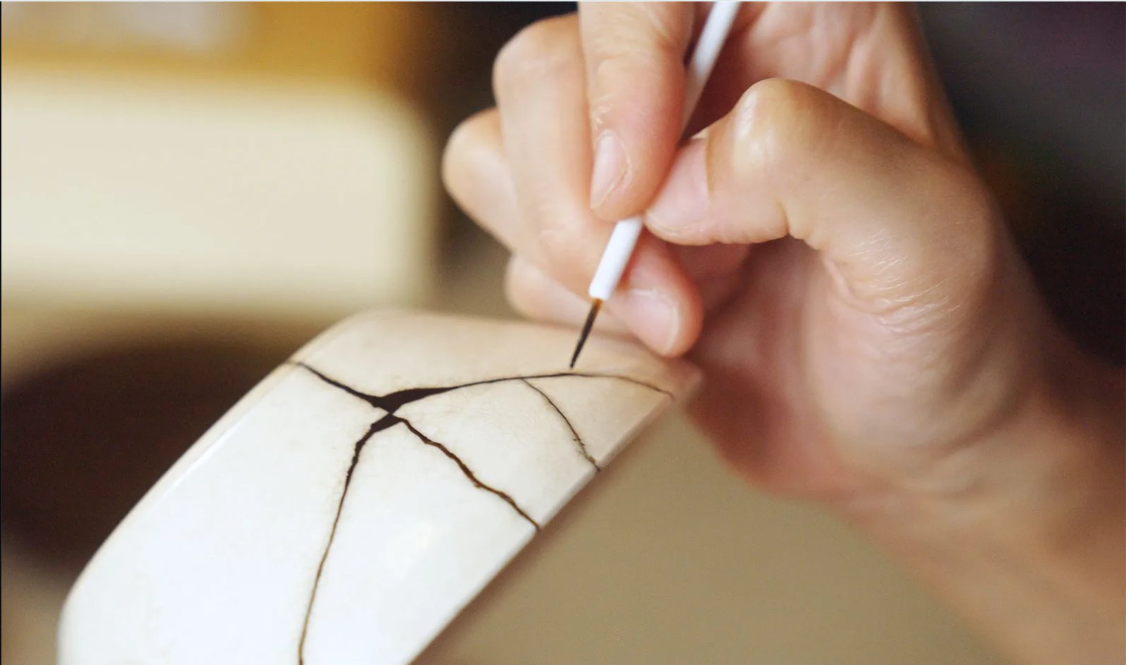 Precision kintsugi bowl repair — fine motor hand function