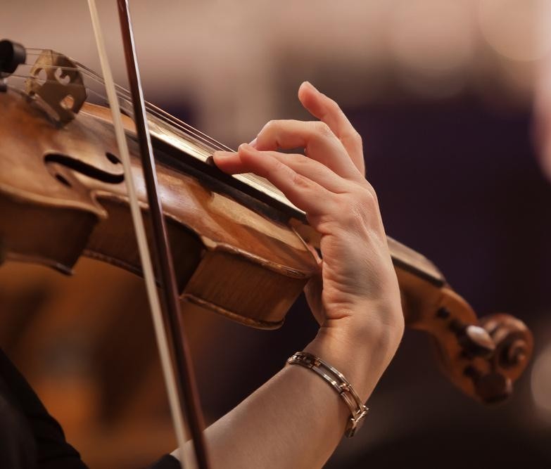 Violinist playing — precision finger function after hand surgery